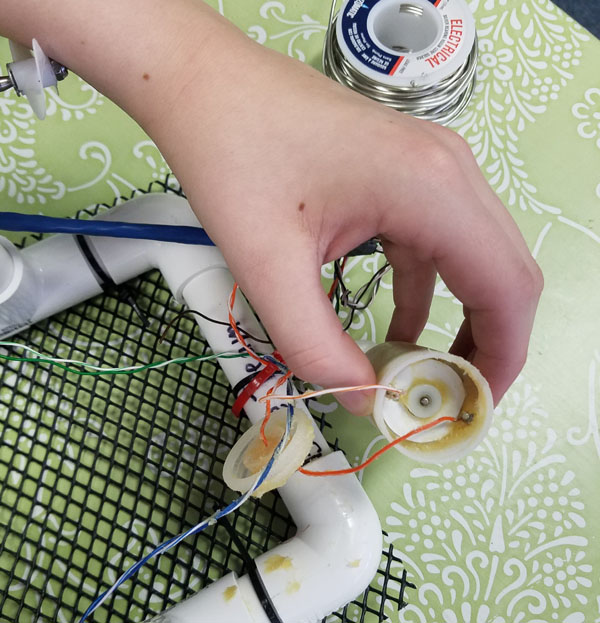 repairing engines - notice the wire going through the engine wires